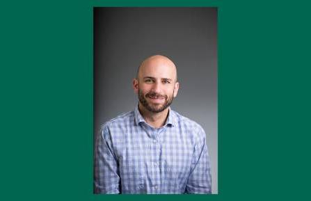 Headshot of Jonathan D. Lichtenstein, PsyD, MBA, on a green background